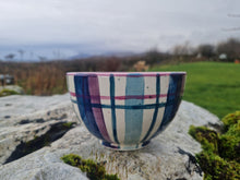 Load image into Gallery viewer, A small bowl sat on a stone covered in lichen.