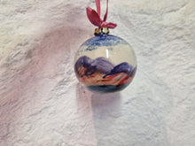 Load image into Gallery viewer, Decorative glass ball ornament with a landscape design on a textured white background
