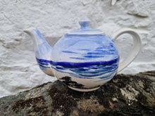 Load image into Gallery viewer, A small teapot hand painted with the sea, sand and rocks
