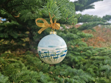 Load image into Gallery viewer, Hanging from a ribbon on a fir tree, a round bauble with sky, sea and sand 
