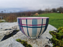 Load image into Gallery viewer, A bowl on a stone covered in moss and lichen. Grass and a hedge in the background
