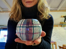 Load image into Gallery viewer, A lady holding a cylindrical tealight holder.
